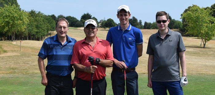 Team of four golfers